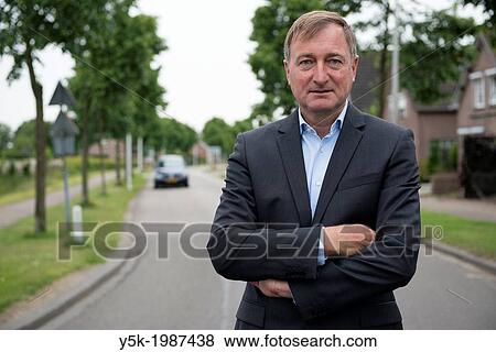 Zundert, Netherlands. Author of pocketbooks in the streets near his house. View Large Photo Image Stock Photo - Zundert, Netherlands. Author of pocketbooks in the streets near his house.. Fotosearch