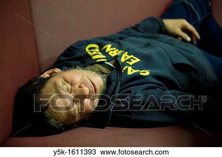 An Indonesian seaman or sailor on the container-vessel MV Flintercape, during a journey from Rotterdam, Netherlands, to Sundsvall, Sweden. The man is an ´Able Seaman´, who generally works on deck. After work men can rest or take a nap in the galley. View Large Photo Image Stock Image - An Indonesian seaman or sailor on the container-vessel MV Flintercape, during a journey from Rotterdam, Netherlands, to Sundsvall, Sweden. The man is an ´Able Seaman´, who generally works on deck. After work men can rest or take a nap in the galley.. Fotosearch