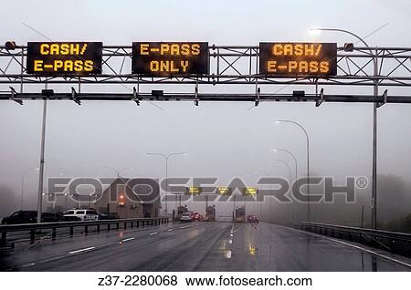 Stock Photo - Approaching a toll booth in fog and mist, Nova Scotia, Canada. Fotosearch