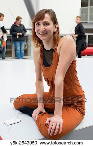 Arnhem, Netherlands. Young brunette ballet dancer taking a break from training and rehearsal just outside her ballet studio. View Large Photo Image Stock Image - Arnhem, Netherlands. Young brunette ballet dancer taking a break from training and rehearsal just outside her ballet studio.. Fotosearch