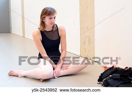Arnhem, Netherlands. Young brunette ballet dancer taking a break from training and rehearsal in her ballet studio. View Large Photo Image Stock Image - Arnhem, Netherlands. Young brunette ballet dancer taking a break from training and rehearsal in her ballet studio.. Fotosearch
