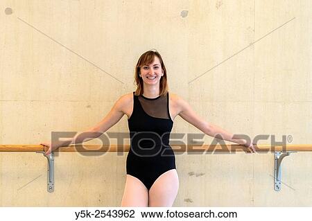 Arnhem, Netherlands. Young brunette ballet dancer training and rehearsing classical ballet in her ballet studio. View Large Photo Image Stock Image - Arnhem, Netherlands. Young brunette ballet dancer training and rehearsing classical ballet in her ballet studio.. Fotosearch