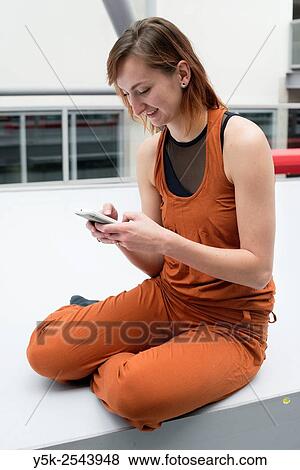 Arnhem, Netherlands. Young brunette ballet dancer taking a break from training and rehearsal just outside her ballet studio. View Large Photo Image Stock Photo - Arnhem, Netherlands. Young brunette ballet dancer taking a break from training and rehearsal just outside her ballet studio.. Fotosearch