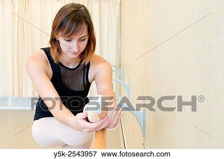Arnhem, Netherlands. Young brunette ballet dancer training and rehearsing classical ballet in her ballet studio. View Large Photo Image Stock Photo - Arnhem, Netherlands. Young brunette ballet dancer training and rehearsing classical ballet in her ballet studio.. Fotosearch