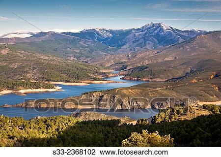 Atazar reservoir and Cabra peak from the Cabeza cliff in the Sierra Norte. Patones. Madrid. Spain. Europe. View Large Photo Image Stock Image - Atazar reservoir and Cabra peak from the Cabeza cliff in the Sierra Norte. Patones. Madrid. Spain. Europe.. Fotosearch