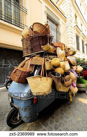 Baskets and straw bags over an Ape Car - Rome, Italy. View Large Photo Image Stock Photo - Baskets and straw bags over an Ape Car - Rome, Italy.. Fotosearch