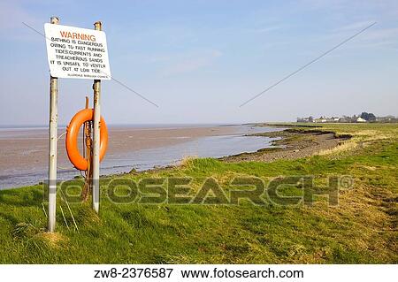 Stock Photo - Bathing Warning Sign. Port Carlisle, Solway Coast, Cumbria, England, UK.. Fotosearch