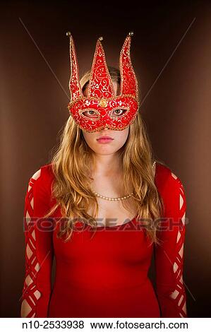 Blonde teenage girl wearing a mask. View Large Photo Image Stock Photo - Blonde teenage girl wearing a mask.. Fotosearch