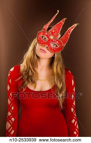 Blonde teenage girl wearing a mask. View Large Photo Image Stock Photo - Blonde teenage girl wearing a mask.. Fotosearch