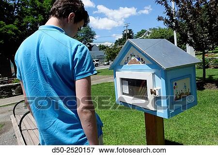 Box for free book exchange in town and teenager. Millerton, New York, USA View Large Photo Image Stock Photo - Box for free book exchange in town and teenager. Millerton, New York, USA. Fotosearch