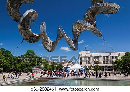 Stock Image - Bulgaria, Southern Mountains, Plovdiv, Ploshtad Tsentralen Square, fountain and buildings.. Fotosearch