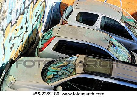 Cars parked in the street next to graffiti wall. Barcelona, Catalonia, Spain View Large Photo Image Stock Image - Cars parked in the street next to graffiti wall. Barcelona, Catalonia, Spain. Fotosearch