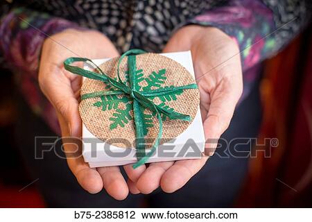 Christmas gift in the hands of a woman View Large Photo Image Stock Image - Christmas gift in the hands of a woman. Fotosearch