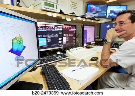 Stock Photo - Control screens, Linear Particle Accelerator, Radiotherapy, Treatment of cancer, Hospital Donostia, San Sebastian, Gipuzkoa, Basque Country, Spain. Fotosearch