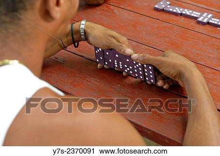 Cuban domino player in Havana, Cuba. View Large Photo Image Stock Image - Cuban domino player in Havana, Cuba.. Fotosearch