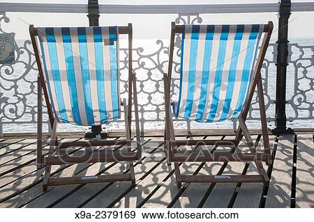 Deck Chairs on Brighton Pier, England. View Large Photo Image Stock Photo - Deck Chairs on Brighton Pier, England.. Fotosearch