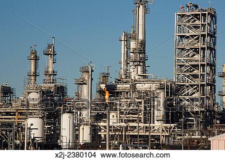 Denver, Colorado - A flare burns off gas at Suncor Energy's oil refinery. View Large Photo Image Picture - Denver, Colorado - A flare burns off gas at Suncor Energy's oil refinery.. Fotosearch