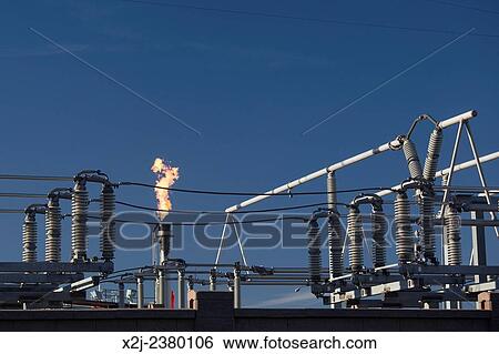 Denver, Colorado - A flare burns off gas at near electrical equipment at Suncor Energy's oil refinery. View Large Photo Image Stock Photograph - Denver, Colorado - A flare burns off gas at near electrical equipment at Suncor Energy's oil refinery.. Fotosearch