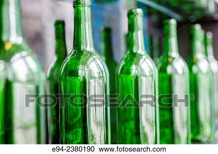 Empty green wine bottles on a shelf. View Large Photo Image Stock Image - Empty green wine bottles on a shelf.. Fotosearch