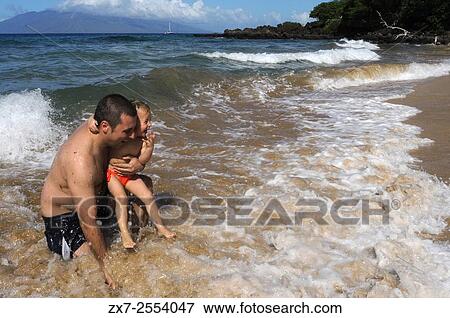 Father with his daughter in Maluaka beach on the south shore of Maui Hawaii. USA Maluaka Beach is just south of Wailea at the end of Makena Road. View Large Photo Image Stock Photo - Father with his daughter in Maluaka beach on the south shore of Maui Hawaii. USA Maluaka Beach is just south of Wailea at the end of Makena Road.. Fotosearch