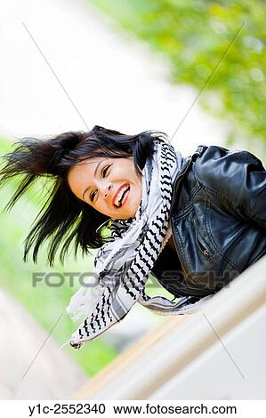 Feeling ecstatic young woman over edge View Large Photo Image Stock Image - Feeling ecstatic young woman over edge. Fotosearch
