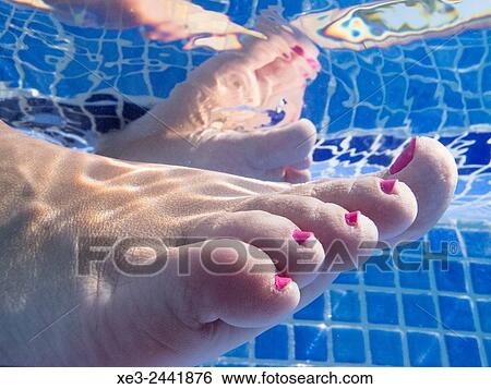 Feet in swimming pool View Large Photo Image Stock Photograph - Feet in swimming pool. Fotosearch