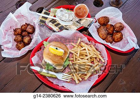 Florida, Port Pt. Salerno, Basin Seafood & and Fresh Fish Market, hush puppies, conch fritters, lunch, French fries, sandwich View Large Photo Image Stock Photograph - Florida, Port Pt. Salerno, Basin Seafood & and Fresh Fish Market, hush puppies, conch fritters, lunch, French fries, sandwich. Fotosearch
