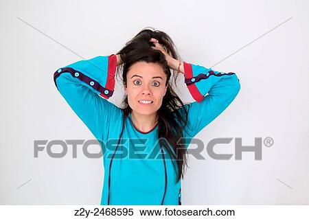 Girl in blue pyjamas holding her hair and eyes very open. View Large Photo Image Stock Photography - Girl in blue pyjamas holding her hair and eyes very open.. Fotosearch