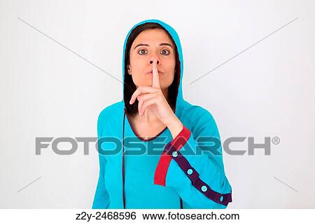 Girl in blue pyjamas with right hand finger in from of her mouth asking for silence. View Large Photo Image Stock Photograph - Girl in blue pyjamas with right hand finger in from of her mouth asking for silence.. Fotosearch