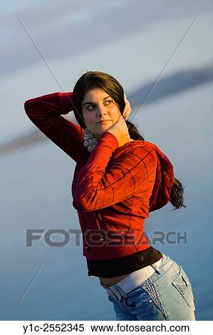 Girl next-door outside looking back over shoulder View Large Photo Image Stock Photography - Girl next-door outside looking back over shoulder. Fotosearch