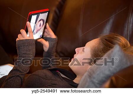 girl video chatting with boy on digital tablet computer. View Large Photo Image Stock Image - girl video chatting with boy on digital tablet computer.. Fotosearch