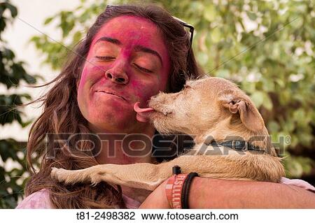 Stock Image - Girl with painted face and pet, Valencia, Spain. Fotosearch