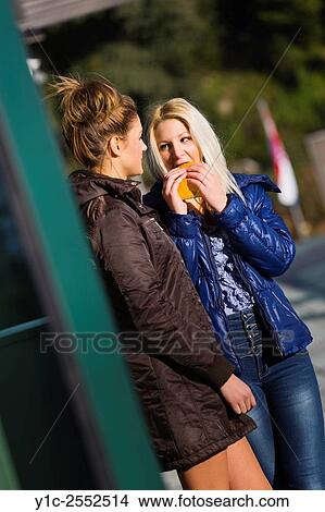 Picture - Girlfriends chat. Fotosearch