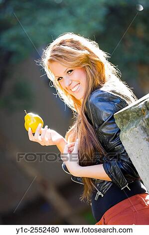 Happy with fruit in hand teen girl. View Large Photo Image Stock Image - Happy with fruit in hand teen girl.. Fotosearch
