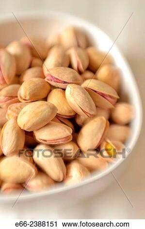 Healthy snacks: bowl of unsalted pistachio nuts. Shot with LensBaby for selective focus. View Large Photo Image Stock Image - Healthy snacks: bowl of unsalted pistachio nuts. Shot with LensBaby for selective focus.. Fotosearch