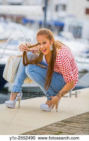 Stock Image - Highheels and denim pants pretty teenager.. Fotosearch
