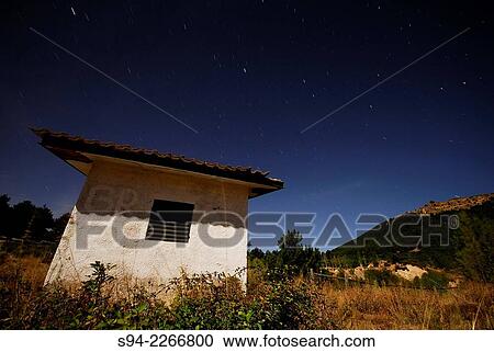 Stock Image - Hut at night in the outskirts of Bustarviejo, Madrid, Spain.. Fotosearch