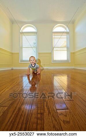 infant boy in an empty room. View Large Photo Image Stock Photo - infant boy in an empty room.. Fotosearch