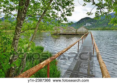 Jetty too Boathouses, Schlehdorf, Lake Kochelsee, Upper Bavaria, Bavaria, Germany. View Large Photo Image Stock Photograph - Jetty too Boathouses, Schlehdorf, Lake Kochelsee, Upper Bavaria, Bavaria, Germany.. Fotosearch