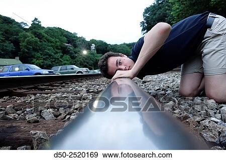 Listening to tracks and penny flattening by train, Harpers Ferry, West Virginia, USA View Large Photo Image Stock Photo - Listening to tracks and penny flattening by train, Harpers Ferry, West Virginia, USA. Fotosearch