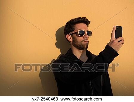 Man using iphone. View Large Photo Image Stock Photo - Man using iphone.. Fotosearch