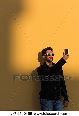 Man using iphone. View Large Photo Image Stock Photo - Man using iphone.. Fotosearch