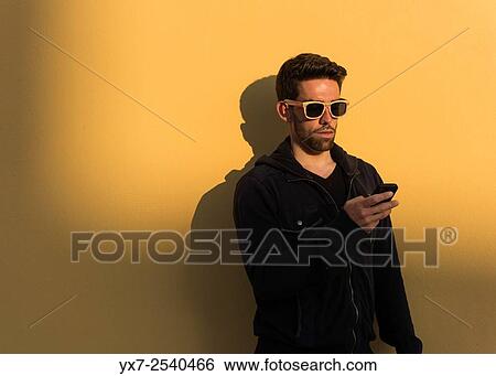 Man using iphone. View Large Photo Image Stock Photograph - Man using iphone.. Fotosearch