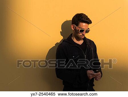 Man using iphone. View Large Photo Image Stock Photography - Man using iphone.. Fotosearch