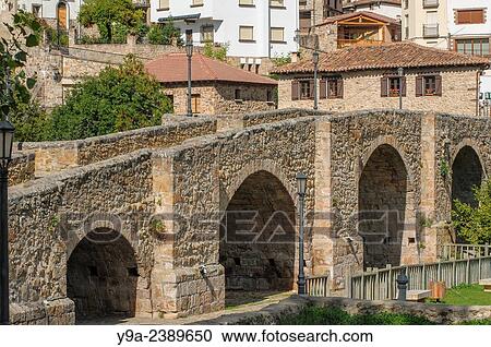 Stock Image - Medieval bridge, Iregua river, Villoslada de Cameros, Sierra de Cebollera Natural Park, Sierra de Cameros, Sistema Iberico, La Rioja, northern Spain.. Fotosearch