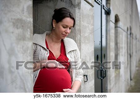 Middel-aged woman, expecting her first child, after being pregnant for 38 weeks. View Large Photo Image Stock Photo - Middel-aged woman, expecting her first child, after being pregnant for 38 weeks.. Fotosearch