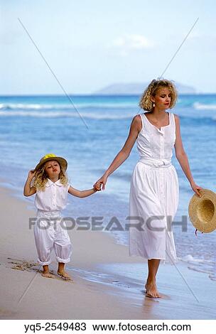 mother and child walking on beach. released. View Large Photo Image Stock Image - mother and child walking on beach. released.. Fotosearch
