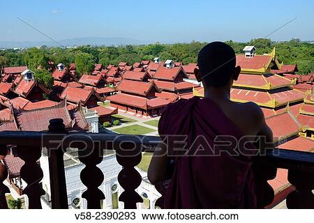 Myanmar, Mandalay, Buddhist monk watching the royal palace from the top of the watchtower. View Large Photo Image Stock Image - Myanmar, Mandalay, Buddhist monk watching the royal palace from the top of the watchtower.. Fotosearch