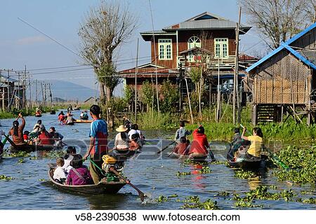 Myanmar, Shan State, Inle Lake, Kay Lar village, Coming out from school. View Large Photo Image Stock Photo - Myanmar, Shan State, Inle Lake, Kay Lar village, Coming out from school.. Fotosearch