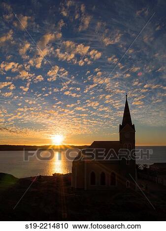 Stock Image - Namibia, Luderitz Church at sunset. Fotosearch